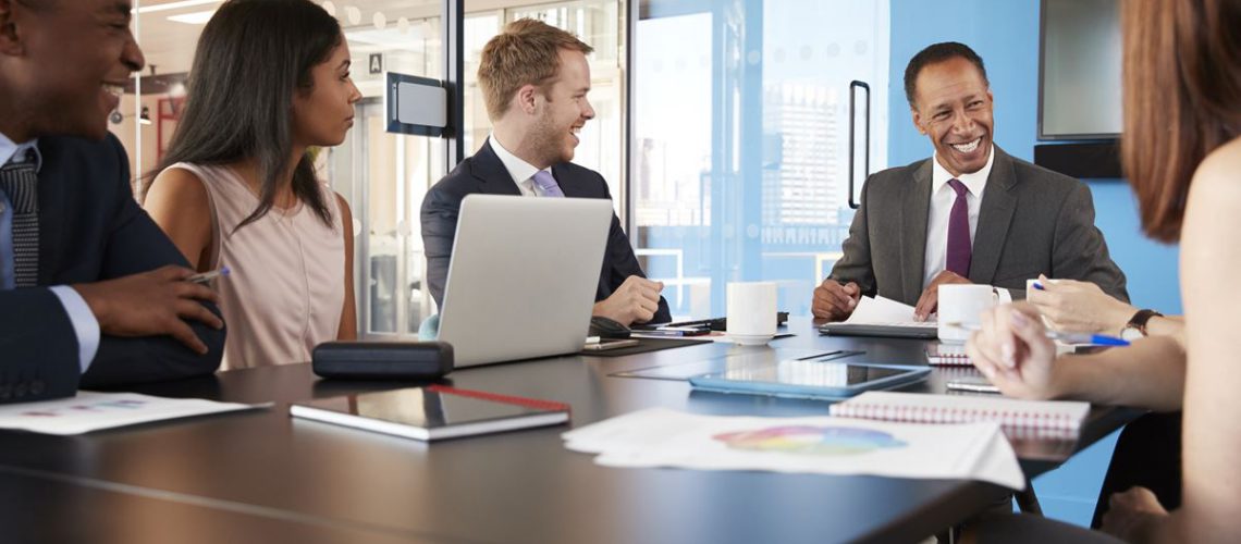 Young professional colleagues at business meeting, close up